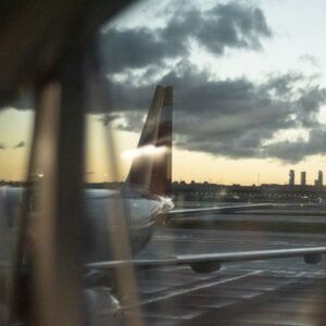a view of a plane from a window at an airport